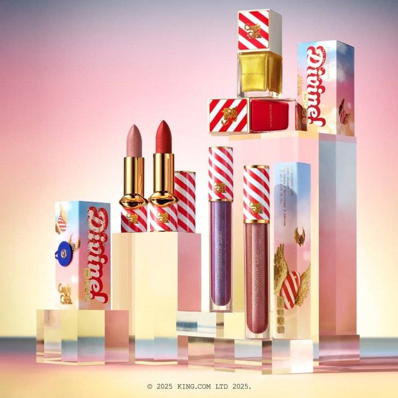 A picture of bejeweled cosmetic packaging with red and gold stripes